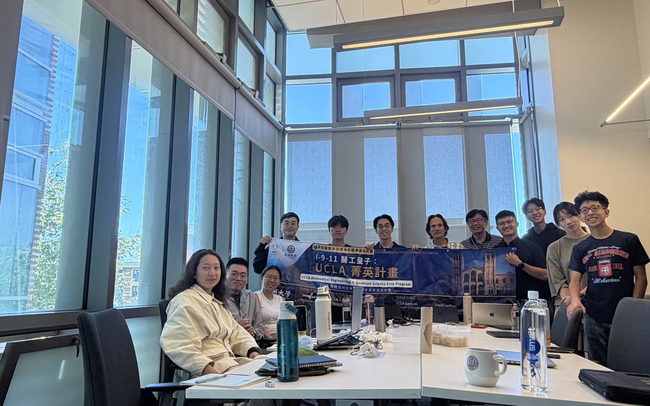 The delegation with the program banner during Week 1 at UCLA