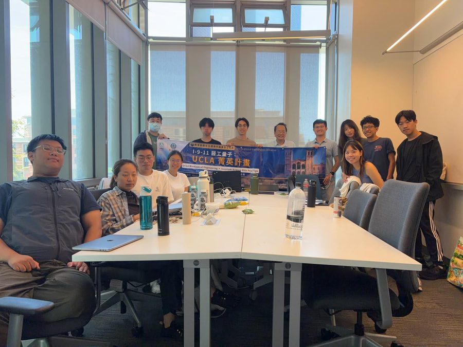 The delegation with the program banner at the close of Week 3