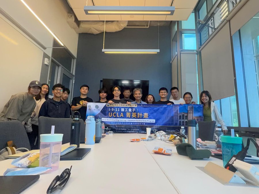 The delegation with the program banner in Week 4