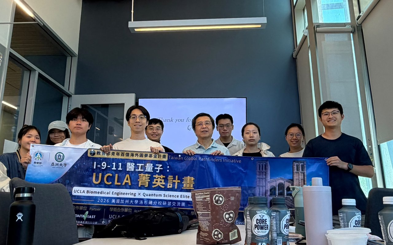 The delegation with the program banner during Week 5 at UCLA